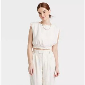 Women's Slim Fit Extended Shoulder Gauze Tank Top - A
New Day™ Cream